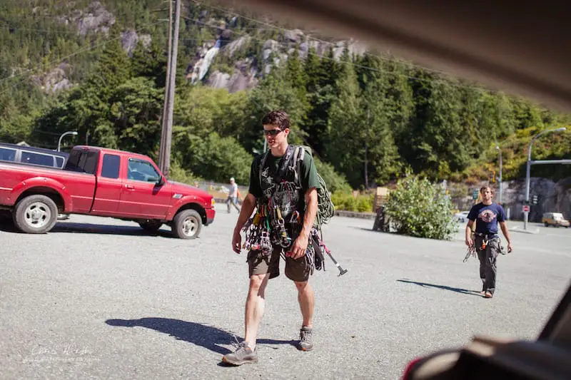 climbers returning after a day of trad climbing in the shannon falls areas of squamish