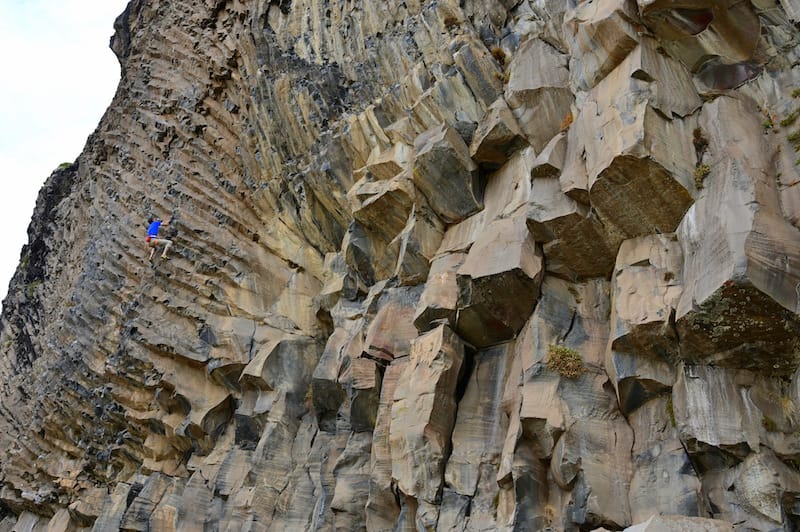 Rock climber on "Calambre" in the Valle de Los Condores of Chile