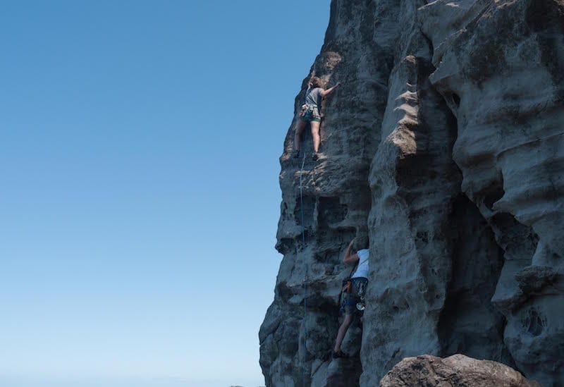 climbers on the middle of their routes