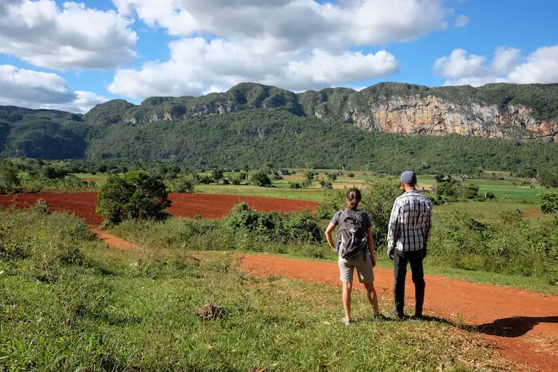 two climbiner looking at the rocks of vinales in cuba
