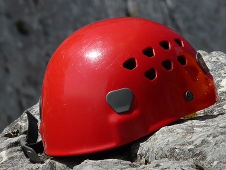 basic red climbing helmet with headlamp climbs