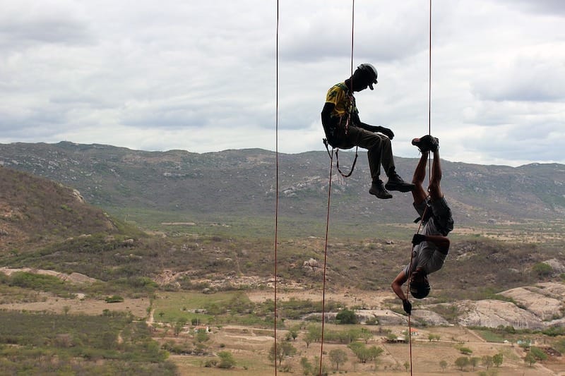 Men rappelling