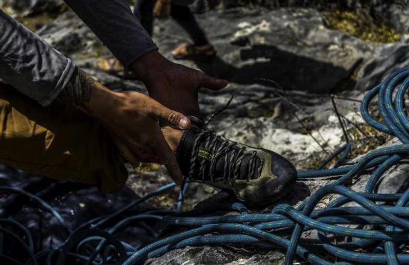 Climber putting on his shoes