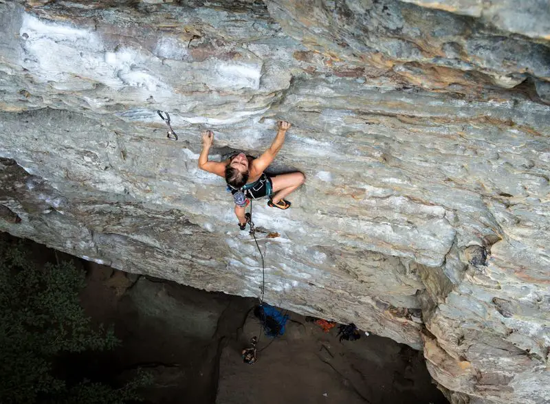 Woman climbing at "The Zoo" in the red river gorge