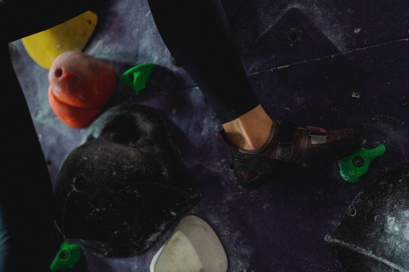 climber in gym, focus on shoes