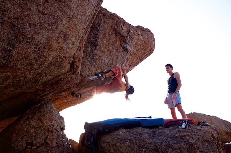 Person doing bouldering outdoors 
