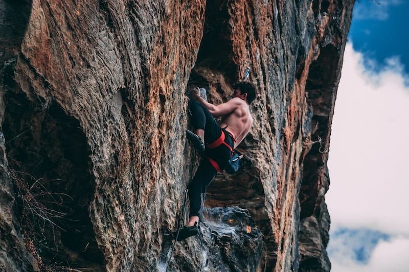 Person climbing on rock 