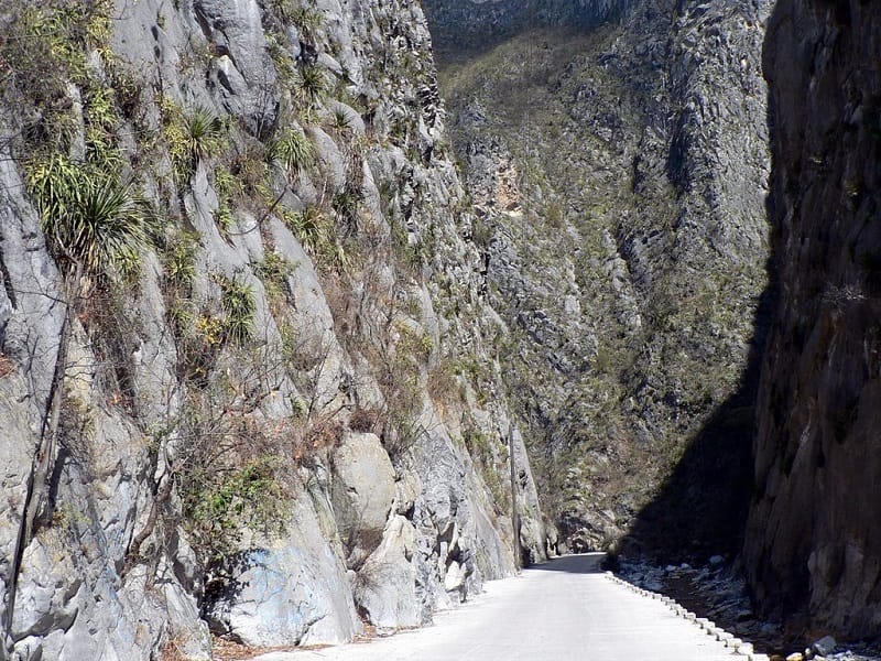 people climbing in cave