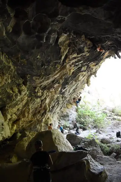 people climbing in cave