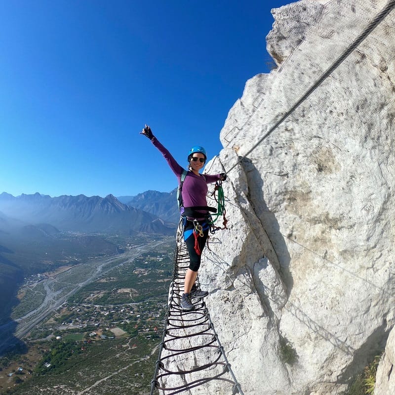 woman climbing Via Ferrata