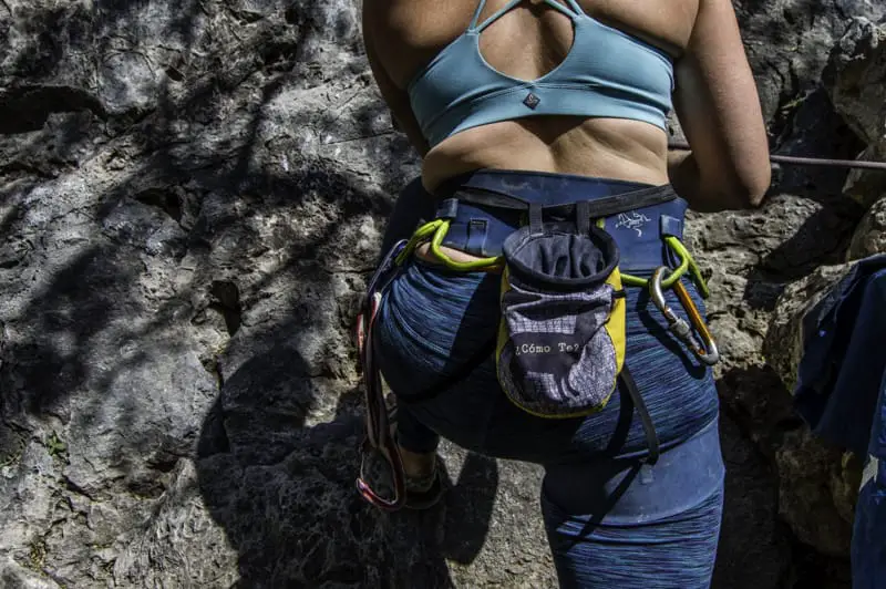 woman climbing harness