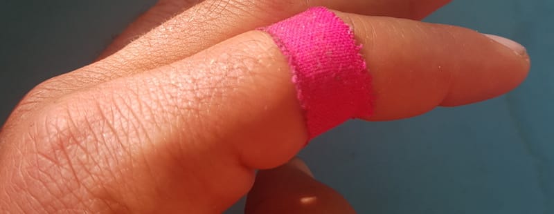 finger with protection tape