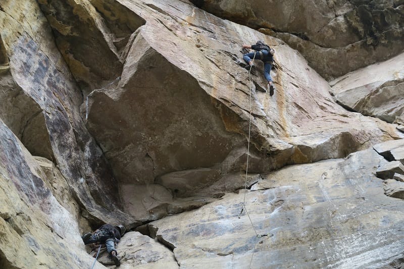 woman climbing rock